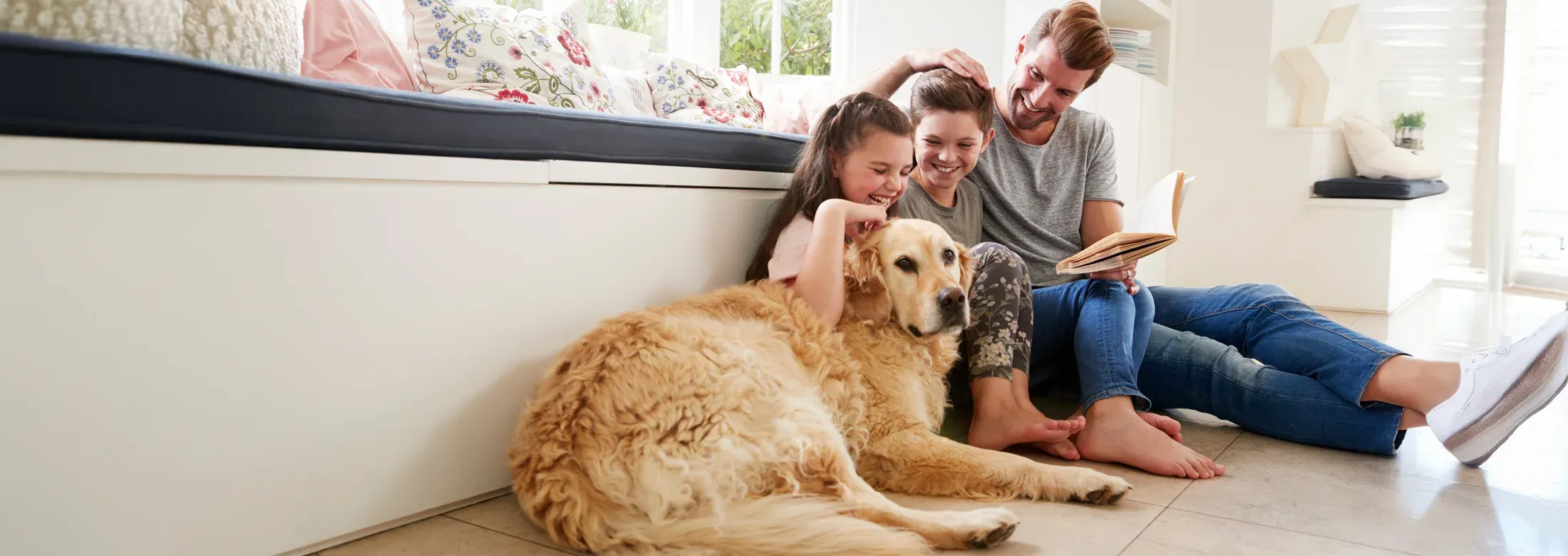family playing with dog
